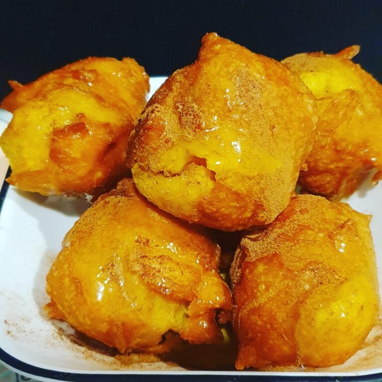 Pumpkin fritters with honey and cinnamon on top